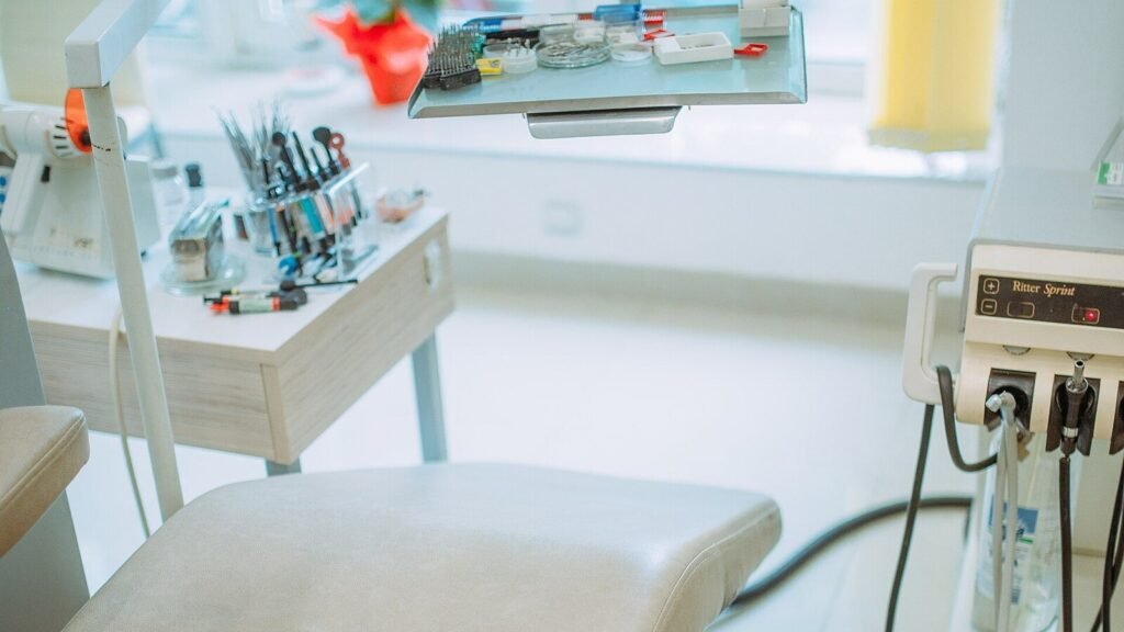Modern dental treatment room with patient chair and clinical equipment